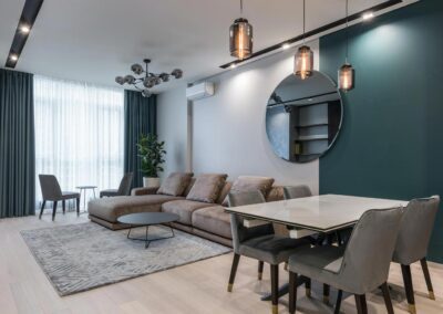 Appartements modern : salon élégant avec miroir rond et tapis